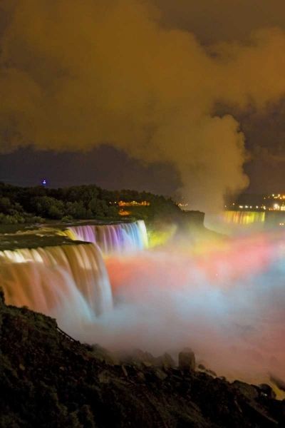 NY, Niagara Falls Waterfalls and mist at night